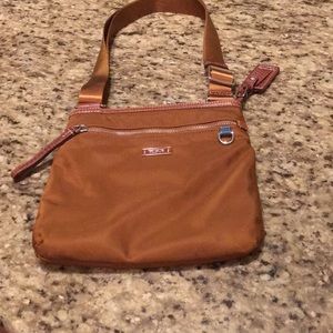 Tumi Cross body bag.